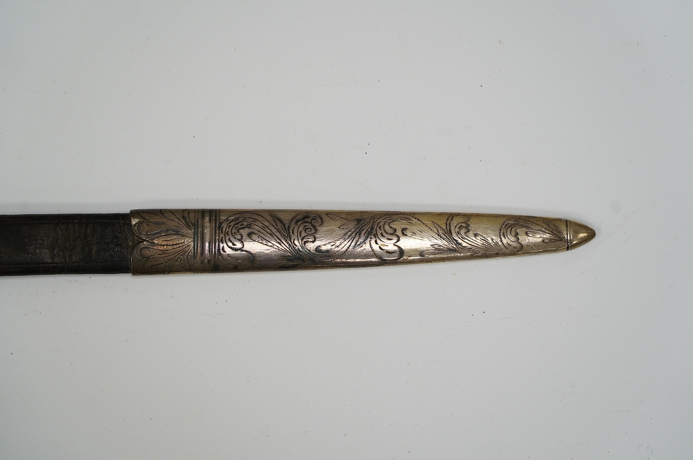 A silver mounted Continental hunting hanger, side guard and knuckle bow with raised decoration, stag horn grip, leather scabbard with later engraved silver mounts, blade 48.5cm. Condition - good